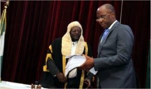 Rivers State Governor, Rt. Hon. Chibuike Rotimi Amaechi presenting the 2014 Budget Appropriation to the Speaker of the State House of Assembly, Rt. Hon. Otelemaba Dan-Amachree.