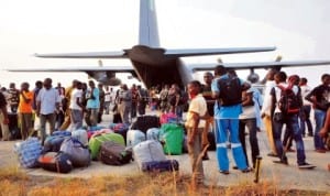 Trapped Nigerians evacuated from the Central African Republic on their arrival at the Nnamdi Azikiwe International Airport in Abuja last Saturday. Photo: NAN