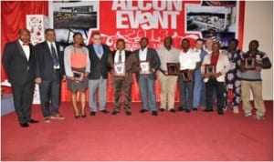 ALCON MD, Mr. Stefano Piotti (4th left), with members of staff presented with meritorious service award at the company’s end of year party held in Port Harcourt, last month.