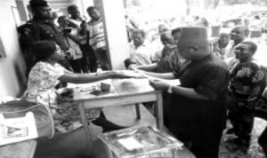 National Chairman of APGA, Chief Victor Umeh (2nd right) , being accredited at Aguluezigbo Civic Centre polling unit, during the local government  elections in Anambra State, last Saturday. Photo: NAN
