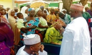 Adamawa State Coordinator, National Directorate of Employment, Malam Aliyu Abubakar (right), addressing beneficiaries during the disbursement of loans to Micro Entrepreneurs in Yola last Monday     Photo: NAN