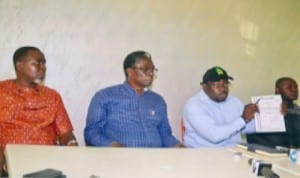 Chairman, Save Rivers Movement, Barr. Aholu O. Charles (2nd right), showing journalists the police permit given to the movement before the rally in Port Harcourt last Sunday. With him are former House of Representatives member and member of the body, Hon Igo Aguma (2nd left), Chairman, Bonny Local GovernmentArea of Rivers State, Barrister Edward Pepple (left) and a member of the Movement, during a press briefing on the aborted rally organised by the group in Port Harcourt, yesterday. Photo: Chris Monyanaga