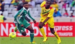 A Super Eagles player being pressurised by a Malian opponent last Saturday