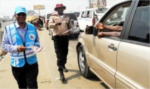Acting FRSC State Co-Ordinator, Special Marshals and Partnership in Anambra, Mr Ben Osaka (left), with the FRSC Unit Commander in Onitsha, Mr Anthony Metta, distributing safety leaflets to motorists during the FRSC campaign against over-loading and over-speeding in Onitsha, recently.