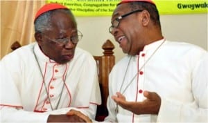 Francis Cardinal Arinze, the Prefect Emeritus, Congregation for Divine Worship and the Discipline of the Sacraments (left), with the Archbishop of Abuja Catholic Diocese, John Cardinal Onaiyekan, at the 2014 annual St. Paul Lecture Series In Abuja On Saturday