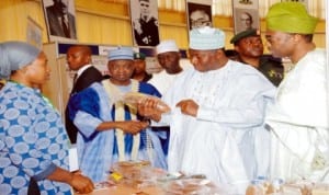 President Goodluck Jonathan (2nd right), inspecting fish and fishery products during the launch of dry season farm  support programme in Abuja last Monday. With him are, Vice President Namadi Sambo (2nd left), Minister of Agriculture, Dr Akinwunmi Adesina (right) and Chief Executive, Fish and Fishery Product Exporter, Mrs Jerry Uwheraka. Photo: NAN.