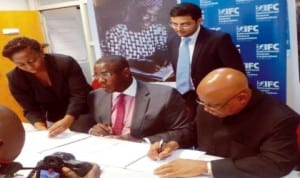  L-R:  International Finance Corporation ( IFC) Country Manager for Nigeria, Mr Solomon Adegbie-Quaynor, Chief Executive Officer, Grooming Centre, Dr Godwin Nwabunike and Executive Director, Mr Adesoji Tayo, during the signing of an agreement   between IFC and Grooming Centre in Lagos, last Monday.                      Photo: NAN