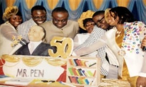 Mr Paulinus Enyinda Nsirim (middle) and his family cutting the birthday cake, during his 50th Birthday Anniversary Thankgiving/Book Launch in Port Harcourt, last Sunday.