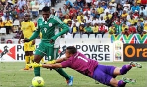 Super Eagles’ Gbolaham Salami (9) trying to round up an opposing goalkeeper at the CHAN in South Africa