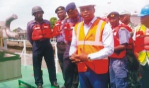 Co-ordinator of NIMASA, Eastern Zone, Mr Anthony Ogadi (middle), speaking while inspecting the two new gunboats acquired by the agency in Bonny, Rivers State, recently.
