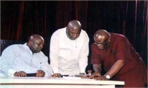 Speaker, Rivers State House of Assembly, Rt Hon Otelemaba Amachree (left) conferring with the Deputy Leader, Hon Robinson Ewor (middle) and Clark of the House, Sir Emmanuel Ogele after the Commissioner for Finance, Dr Chamberlain Peterside had defended the N100bn bond being obtained by the state government at the sitting of the House, yesterday. Photo:Chris Monyanaga