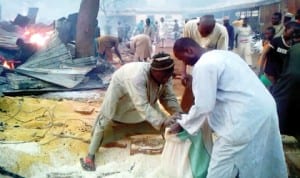 Traders salvaging their wares as Kara Market in Sokoto State is gutted by fire last Wednesday.