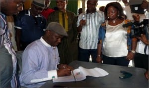 Member, House of Representatives, Hon Dakuku Peterside (sitting), registering as APC member at Unit 5, Ward 3, Opobo Town, last Friday.