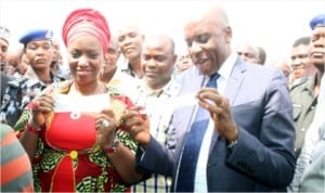 Rivers State Governor, Rt. Hon. Chibuike Rotimi Amaechi (right), and his wife, Dame Judith Amaechi, displaying their APC membership cards shortly after registration in Ubima, Rivers State, last Monday. 