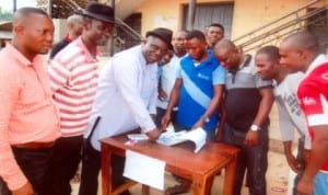 Special Adviser to the Rivers State Governor on Inter-Party Matters, Hon. Solomon Ebeku (3rd left), registering as APC member at Ward 7, Ula-Upata in Ahoada East LGA recently, while other APC supporters watch. Photo: King Osila