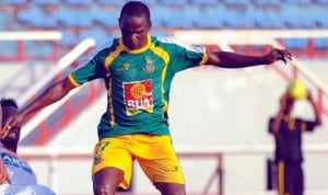 Kano Pillars striker under presure in a domestic encounter