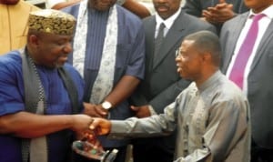 Chairman, Imo State Correspondents Chapel, Chris Nwokocha (right), presenting an award of achievement to Governor Rochas Okorocha  at an interactive forum with the Governor in Owerri last Monday. Photo: NAN