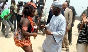 Ex-President Olusegun Obasanjo shows his stuff as he dances with an Iria dancer in Buguma, during his two-day visit to Rivers State