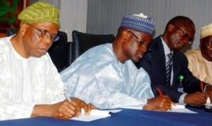 L-R: Executive Secretary, National Universities Commission, Prof. Julius Okojie, Director-General, Small and Medium Enterprises Development Agency of Nigeria (SMEDAN), Alhaji Bature Masari and Vice Chancellor, Kaduna State University, Prof. Barnabas Qurix, signing an MoU on network of African students entrepreneurship development programme in Abuja, recently.