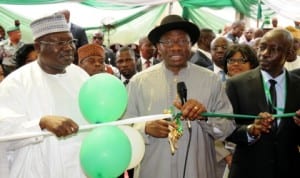 President Goodluck Jonathan (middle), cutting the tape to inaugurate the Office of the Auditor-General for the Federation in Abuja yesterday. With him are Chairman, Senate Committee on Public Accounts, Sen. Lawan Ahmed (left) and the Auditor-General for the Federation, Mr Samuel Ukura.