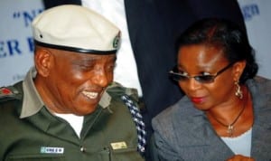  Corps Coordinant-General, Environmental Ethics and Safety Corps, Elder Emenike Eme (left), with representative of the Special Adviser to the President on Ethics and Values, Mrs Yeseinde Shebioba, at the launching of new centenary, cleaner environment campaign in Abuja on Monday