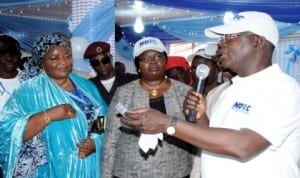 L-R: 2nd Deputy President, Kaduna Chamber of Commerce, Industry, Mines and Agriculture (KADCCIMA), Mrs Farida Dankaka, Director of Administration, Nigeria Deposit Insurance Corporation (NDIC), Christiana Afabor and Head of Communication and Public Affairs, Mr Hadi Birchi, during the NDIC Day at the on-going 35 Kaduna International Trade Fair in Kaduna last Thursday