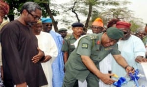 L-R: Minority Leader, House of Representatives, Rep. Femi Gbajabiamila, Commander, Nigerian Army Band Corps, Abalti Barracks,  Brig.-Gen. Lawson Amaechi and others at the inauguration  of one of the sixty solar powered bore-holes by Rep. Gbajabiamila  in Lagos, recently.