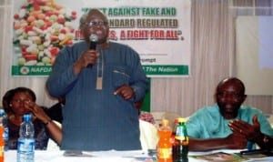 nafdac Director of Planning, Research and Statistics, Dr Samson Adebayo (middle), speaking at a sensitisation workshop for medicine sellers and distributors within the bridge-head drug market at Onitsha in Anambra State on Friday. With him are the head of nafdac in Anambra, dr christiana esenwah (left) and chairman, bridge-head drug market, Mr Ugochukwu Nwosu. Photo: NAN