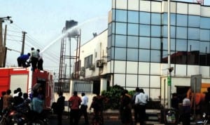 Fire fighters putting off fire on a building in Ibadan, recently. 