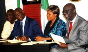 L-R: Deputy Speaker, Lagos State House of Assembly, Mr Kolawole Taiwo, Gov. Babatunde Fashola of Lagos, Deputy Governor, Mrs Adejoke Orelope Adefulire and Attorney General and Commissioner for Justice, Mr Ade Ipaye, at the signing into law of anti smoking bill and establishment of emergency command and control centre by Gov. Fashola in Lagos, recently. Photo: NAN