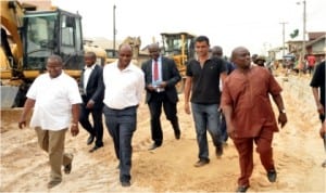 Rivers State Governor, Chibuike Amaechi (2nd left) and Commissioner for Works, Victor Giadom (right) inspecting on-going work on the Elioparanwo Road Project, yesterday