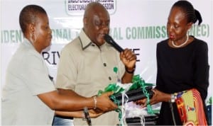 L-R: Head, Protocol and Publicity, Independent National Electoral Commission, Tonia Nwobi, Resident Electoral Commissioner, Mr Aniedi Ikoiwak and Representative of Rivers  Governor, Dame Alice Lawrence-Nemi, during the presentation of computers to Rivers State  Government at INEC office in Port Harcourt, yesterday.