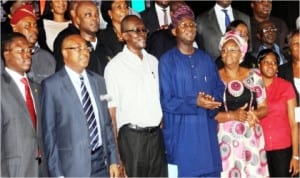 L-R: Lagos State Commissioner for Finance, Mr Ayo Gbeleyi, his Housing counterpart, Mr Bosun Jeje, a winner of Lagos State Housing Mortgage Scheme, Mr Sylvester Akintoye, State Governor, Babatunde Fashola, his wife,  Abimbola and some winners of the Mortgage Scheme  at the 1st Draw of Lagos Home Ownership Mortgage Scheme in Lagos, last Tuesday.