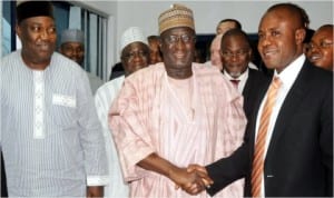 Minister of Transport, Senator Idris Umar (middle), welcoming the leader of the delegation of Pinnacle Oil and Gas Limited, Mr Peter Mba (right), during the handover of Single Point Mooring Project to the company in Abuja. With them is the Chairman, House Committee on Marine Transportation, Rep. Ifeanyi Ugwuanyi.