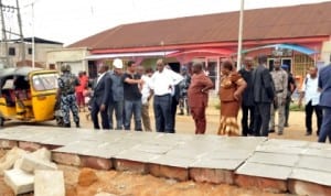 Governor Chibuike Rotimi Amaechi of Rivers State (middle), inspecting a road project under construction in Port Harcourt recently. 