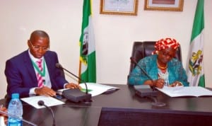  Permanent Secretary, Federal Ministry of Environment, Mr Taiye Haruna (left),  and the Minister, Mrs Lawrencia Labaran-Mallam, during the minister's assumption of duty in Abuja last Thursday. Photo: NAN