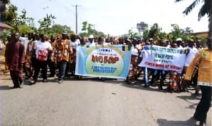 Ogonis marching during the  Ogoni Day celebration in Bori recently. 