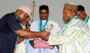 National President, Senior Staff Association of Nigerian Universities (SSANU), Comrade Samson Ugwoke (left), presenting a Merit Award to representative of the Governor of Bauchi State, Mr Abdon Gin (right), during SSANU'S National Executive Council meeting and merit award ceremony in Bauchi, recently.