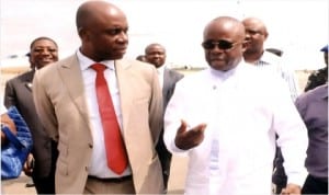 Governor Chibuike Amaechi of Rivers State (left) with commissioner for Special Duties, Barrister Dickson Umunakwe at the Port Harcourt International Airport, Omagwa to see-off the visiting former British Foreign Secretary, Mr Jack Straw and former Prime Minister of Ireland, John Bruton, recently 