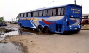 A luxury bus of the E. Ekesons Transport fleet recently broke down in a pothole in front of Rivers State Newspaper Corporation,  Port Harcourt