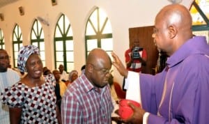  Senate President, David Mark (2nd-r), receiving Ash of Repentance from  Rev.Fr. Innocent Jooji at Saint Mulumba Catholic Chaplaincy, Apo Legislative  Quarters in Abuja, during the Ash Wednesday Mass to mark the beginning of Lent last Wednesday. With them is, Wife of  the Senate President, Helen.