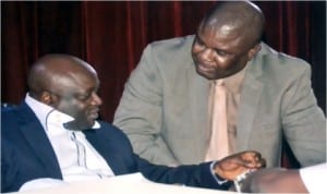 Speaker, Rivers State House of Assembly, Rt Hon Otelemaba Dan-Amachree (left) conferring with Deputy Leader of the House, Hon Robison Ewor during the sitting of the House last Monday.    