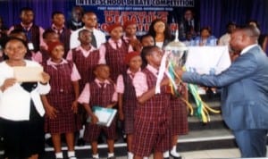 Rivers State Commissioner for Local Government Affairs, Hon. Eyiba (right) presenting an award to the Sure Foundation Comprehensive College, Port Harocurt, as the winner of the Inter-School debate competition organised by Port Harcourt City Council, recently. Photo: Prince Obinna Dele. 