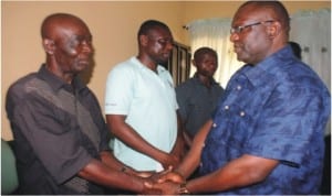Comptroller ,Rivers State Immigration Command, Mr Mike Longe (right), condoles Mr Okezie Kalu, father of Sunday Kalu (left), one of the applicants who died during recruitment exercise of Nigeria Immigration Service penultimate Saturday