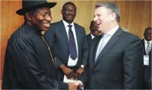 President Goodluck Jonathan (left) in a handshake with the Chief Executive Officer of Shell Petroleum International, Mr Ben van Beurden, during a meeting in Amsterdam, Netherlands, yesterday