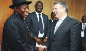 President Goodluck Jonathan (left) in a handshake with the Chief Executive Officer of Shell Petroleum International, Mr Ben van Beurden, during a meeting in Amsterdam, Netherlands, yesterday