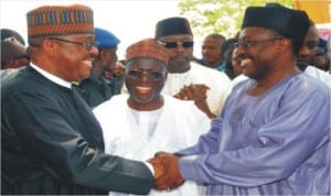 Minister of Works, Mr Mike Onolememen (left), being welcomed by the Chairman, Senate Committee on FCT, Senator Smart Adeyemi (right), at the inauguration of Rehabilitation Work on Egbe-Kabba Road, Kogi State, yesterday. With them is Kogi State Governor Idris Wada.