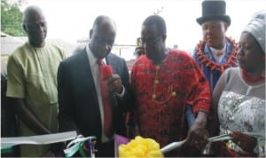 Rivers State Governor, Chibuike Rotimi Amaechi (Right) flanked by High Chief Jonah Tamuno and Ogu/Bolo council chairman, Hon (Mrs) Maureen Tamuno at the commissioning of an electricity project in Ogu/Bolo LGA at the weekend.