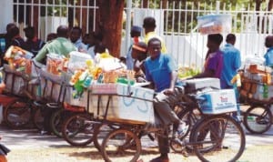 Mobile hawkers of assorted items in Abuja. Photo: NAN