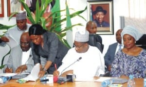 Managing Director, Centenary City Plc, Dr Odenigwe Michaels (2nd left) and FCT Minister, Senator Bala Mohammed, signing MoU on Centenary City construction in Abuja, last Friday. With them is Minister of State For FCT, Oloye Olajumoke Akinjide. Photo: NAN